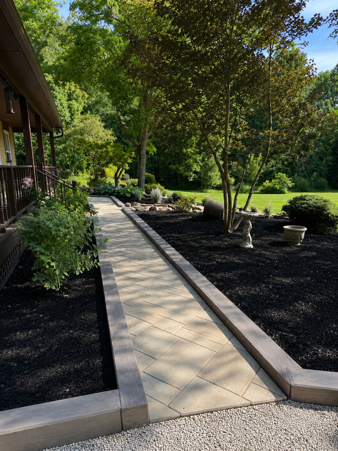Walkway, Fresh Mulch Beds, and Techo-Bloc Borealis Border Done Right image