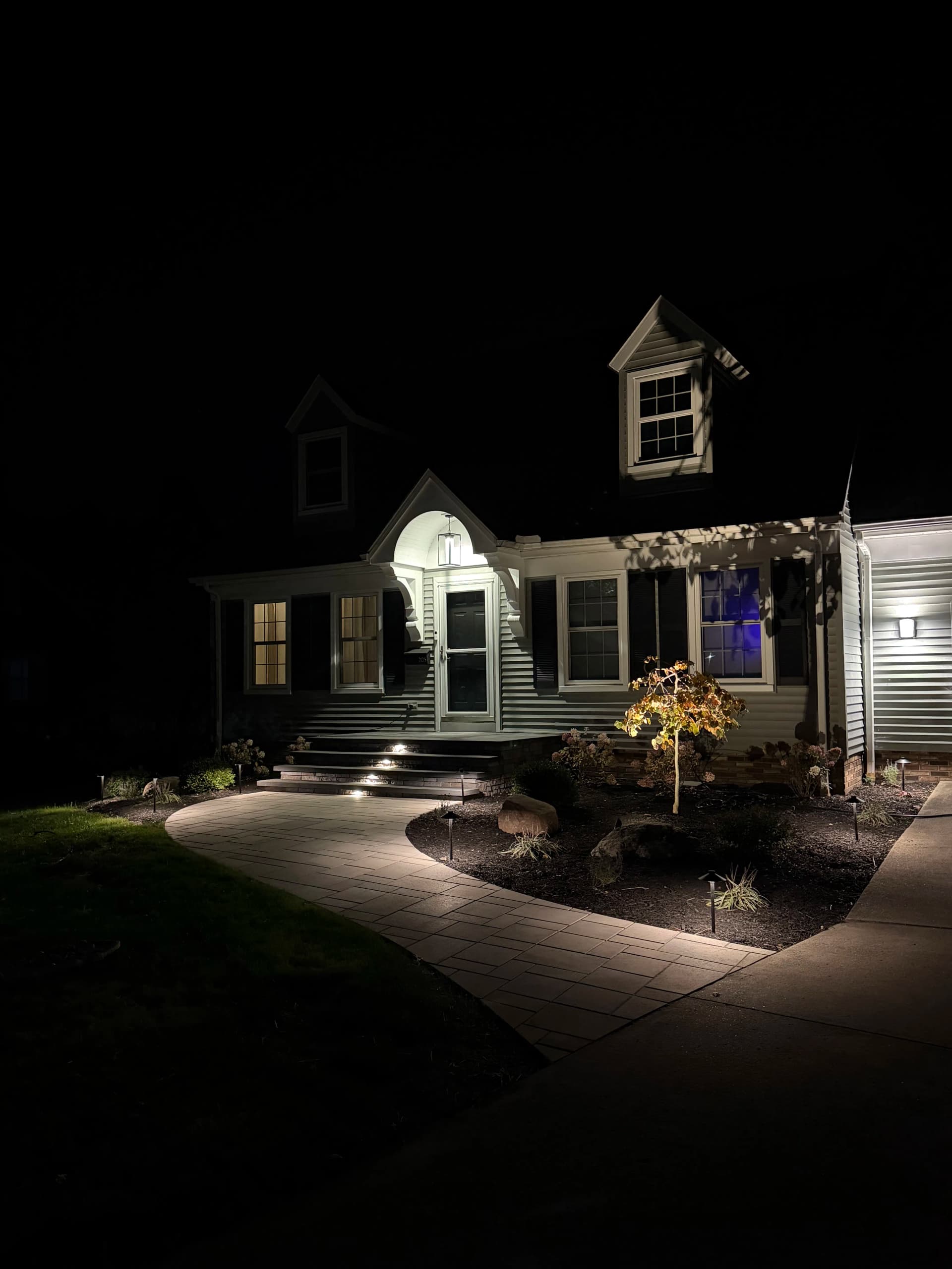 Landscape Lighting That Makes a Front Entrance Come Alive at Night image