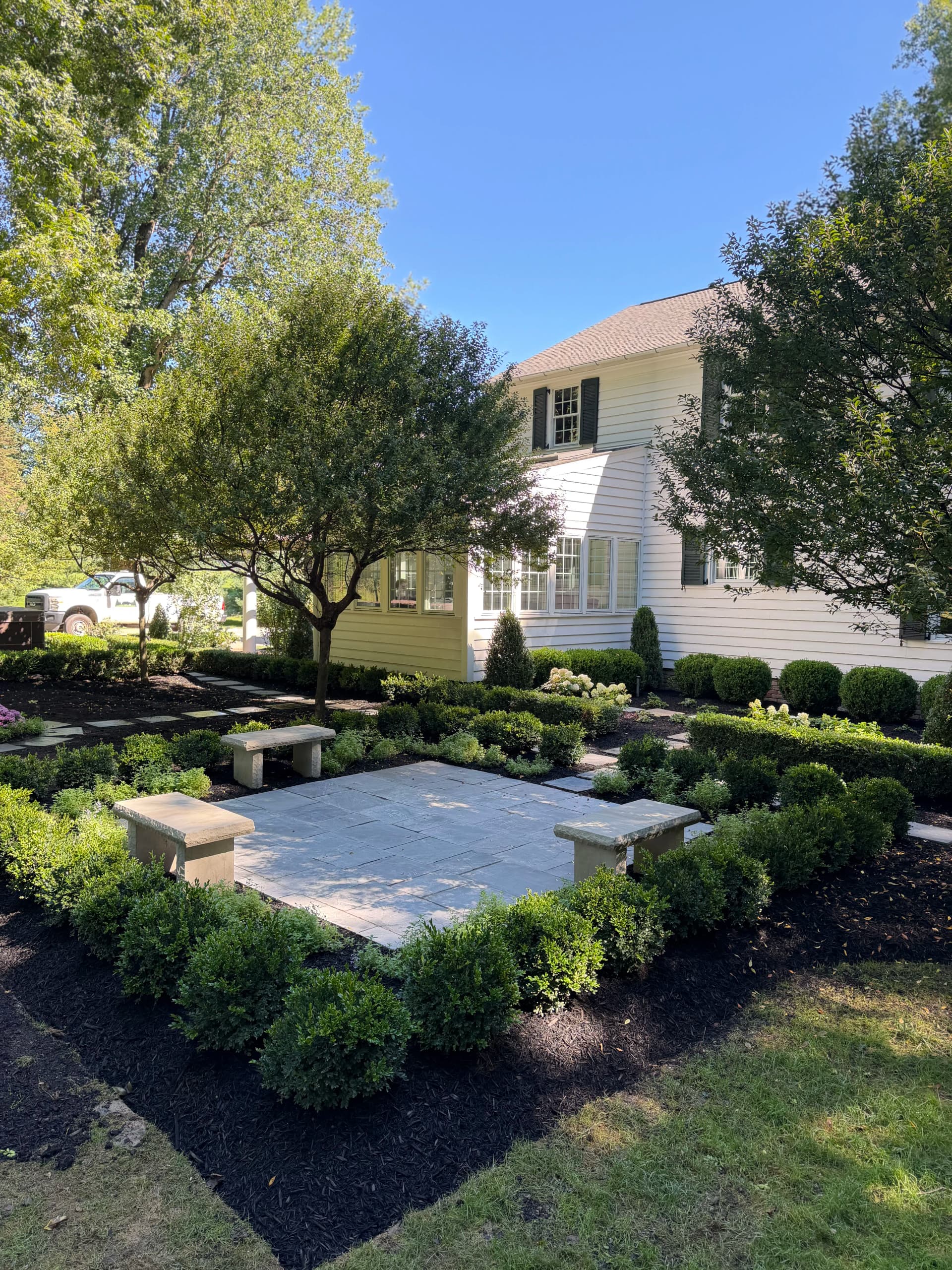 Bluestone Patio and Formal Garden Built From the Ground Up image